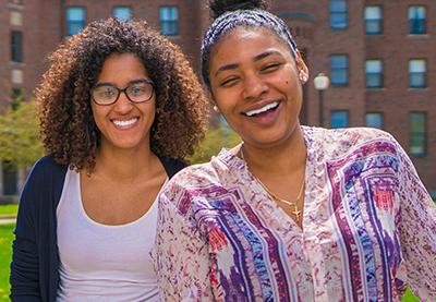 Two smiling HEOP students in front of Francis Hall